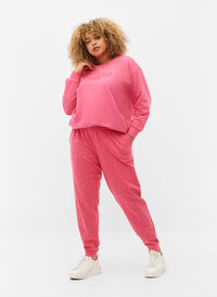 Jogginghose mit Print und Taschen, Hot Pink AOP, Model
